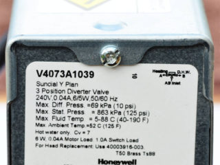 Cover securing screw on Honeywell motorised valve actuator or powerhead