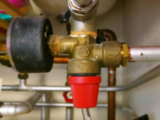 Brass 3-bar safety valve connected to pipework
